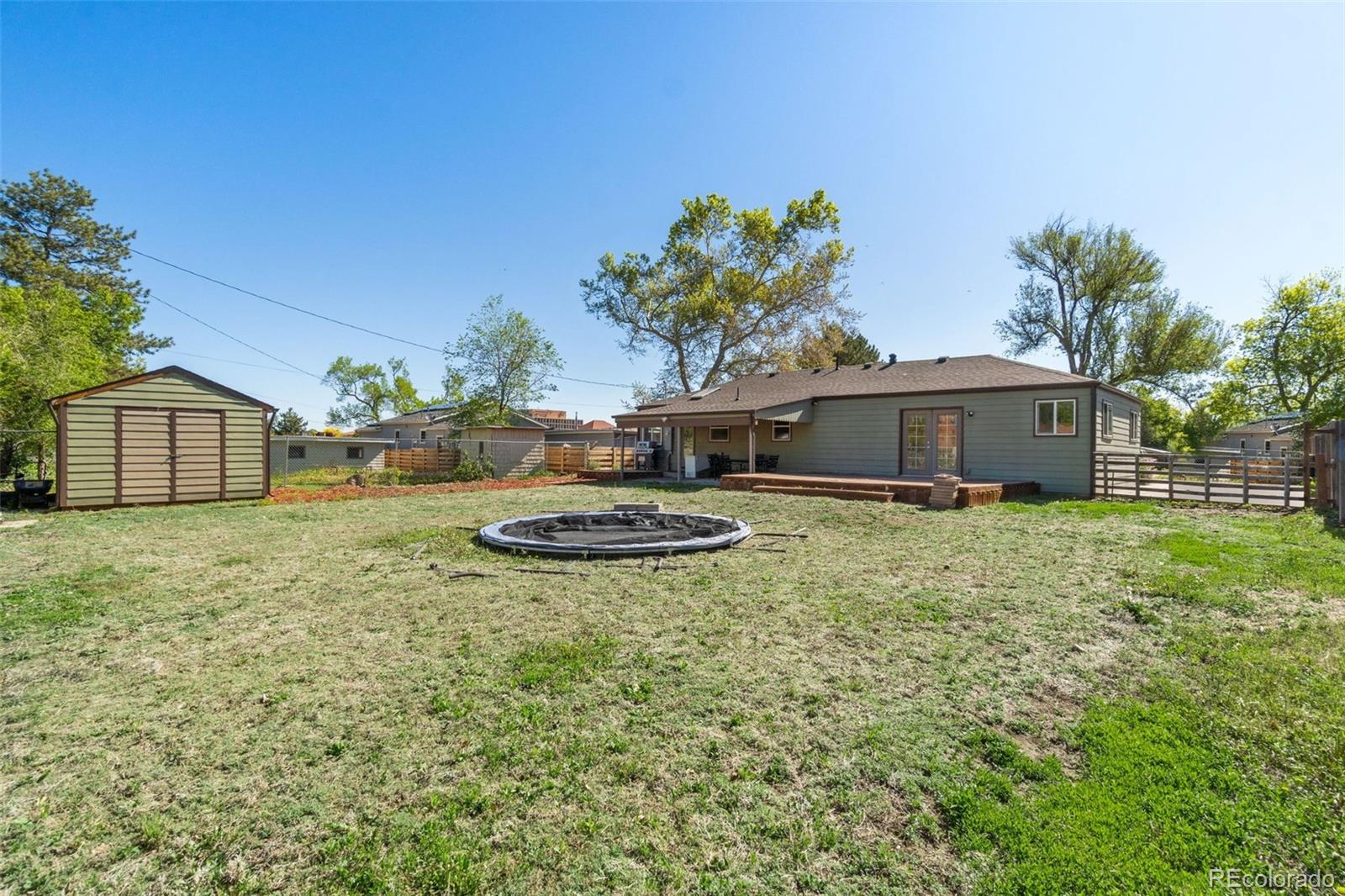 4545 Ingalls Street Wheat Ridge, CO 80033 - Photo 30 of 30 a view of a house with a backyard