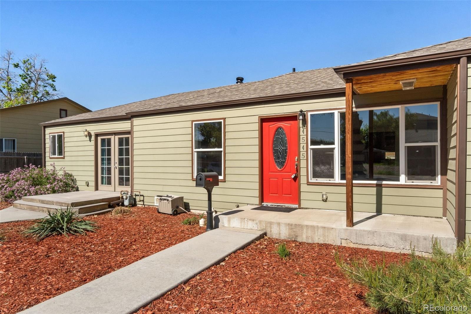 4545 Ingalls Street Wheat Ridge, CO 80033 - Photo 3 of 30 a front view of house with outdoor seating