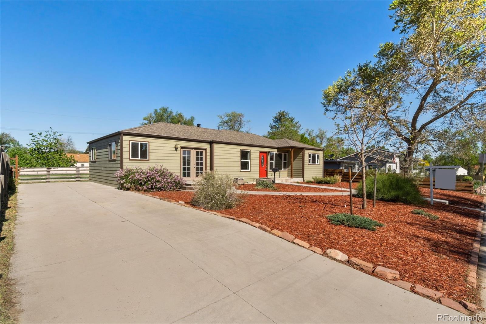 4545 Ingalls Street Wheat Ridge, CO 80033 - Photo 5 of 30 a front view of a house with a yard