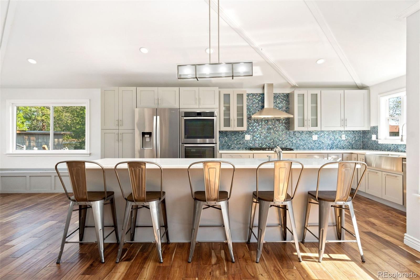 4545 Ingalls Street Wheat Ridge, CO 80033 - Photo 7 of 30 a view of a dining room with furniture and wooden floor