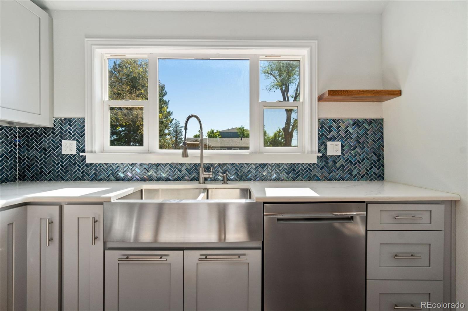 4545 Ingalls Street Wheat Ridge, CO 80033 - Photo 10 of 30 a kitchen with a sink and a window