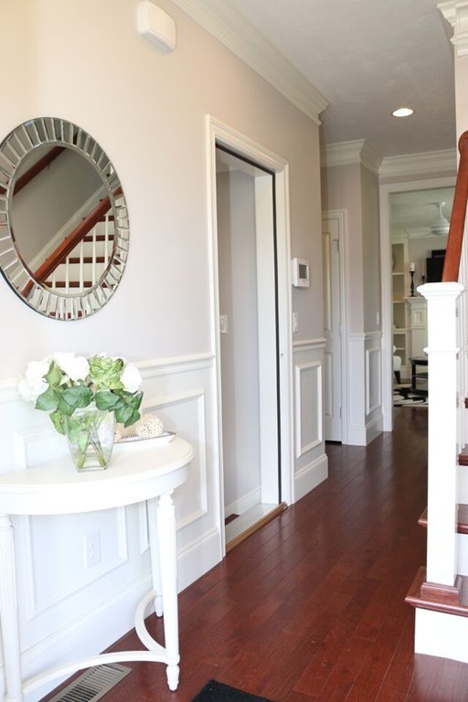 29 Brookview Road Franklin, MA 02038 - Photo 3 of 12 a view of a hallway with wooden floor and a potted plant