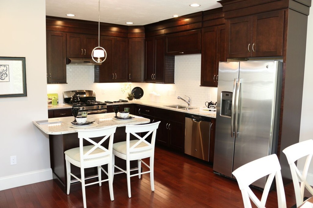 29 Brookview Road Franklin, MA 02038 - Photo 4 of 12 a kitchen with a dining table and chairs