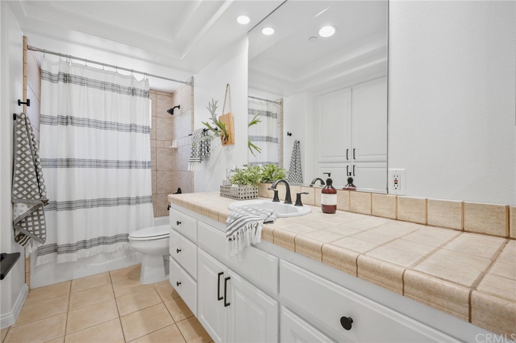 101 Esplanade San Clemente, CA 92672 - Photo 16 of 54 a bathroom with a double vanity sink toilet and shower