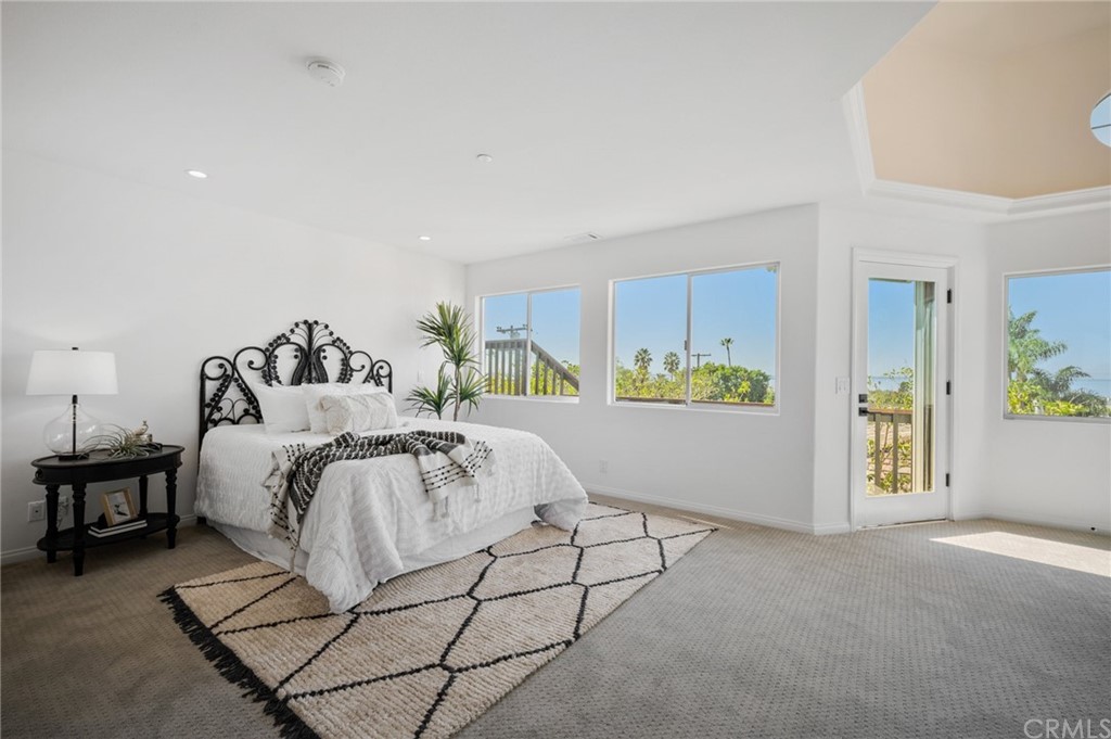 101 Esplanade San Clemente, CA 92672 - Photo 21 of 54 a spacious bedroom with a bed and a cabinets