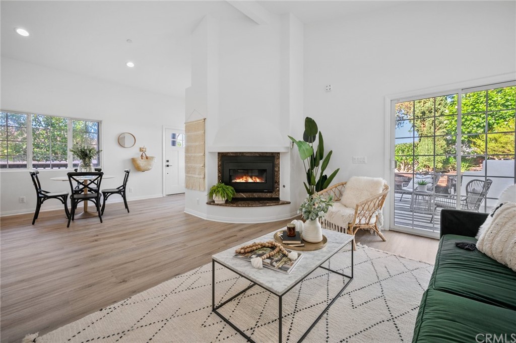 101 Esplanade San Clemente, CA 92672 - Photo 10 of 54 a living room with furniture a fireplace a rug and a large window