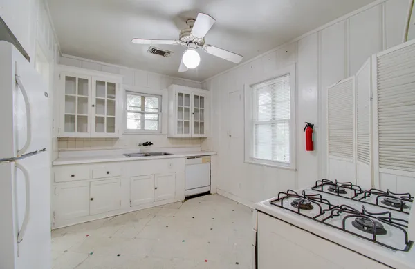 a bathroom with a sink vanity granite tub and shower