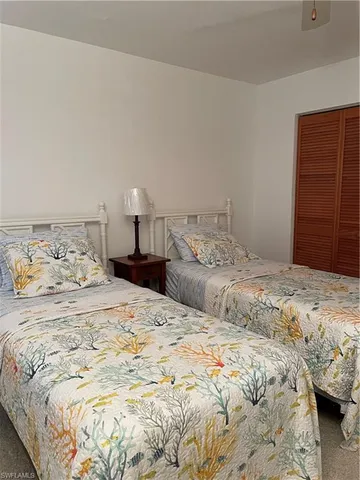 a bedroom with a bed and a closet