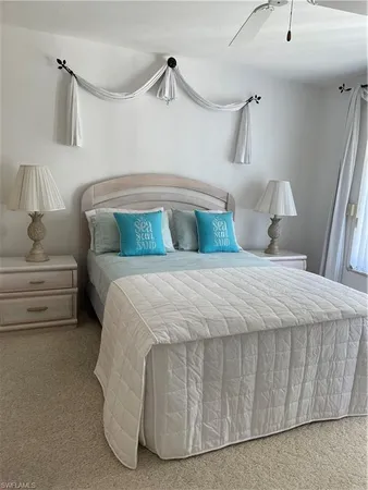 a bedroom with a bed and a mirror