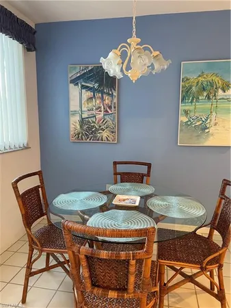a table and chairs in a small room