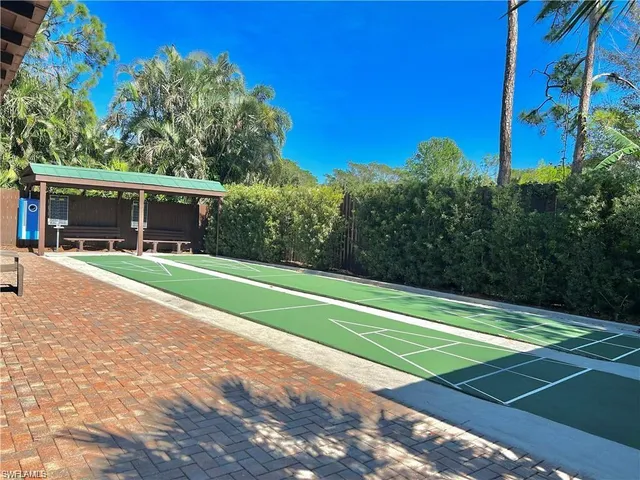a view of swimming pool with a yard