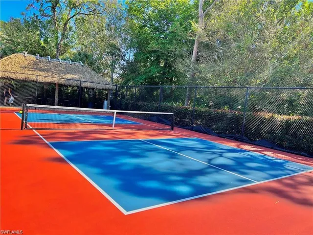 a view of a swimming pool with an outdoor seating