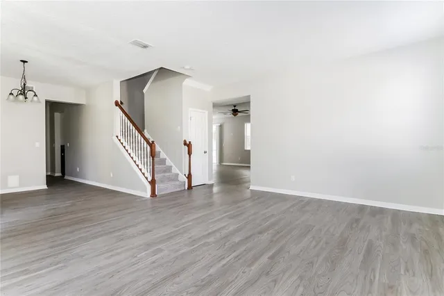 a view of an entryway with wooden floor