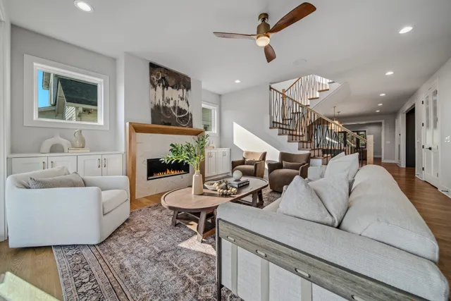 a spacious bathroom with a granite countertop sink a mirror a shower and a bathtub