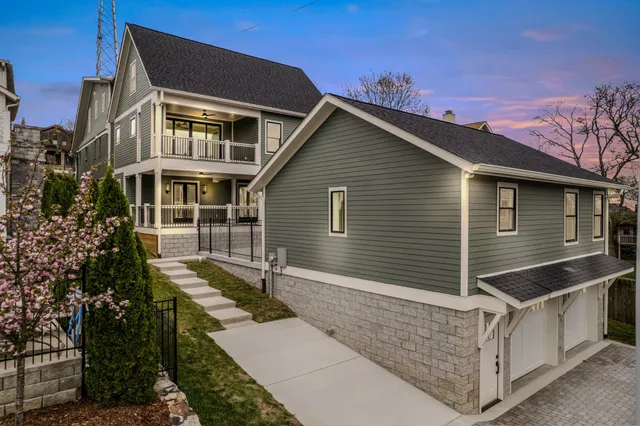 a living room with furniture a fireplace and a window