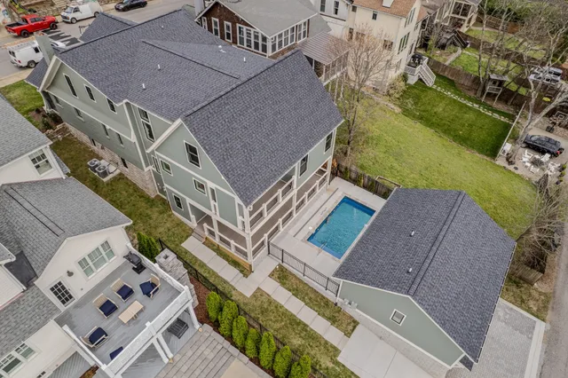 an aerial view of residential houses with outdoor space
