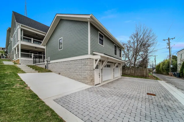 an empty room with wooden floor and window