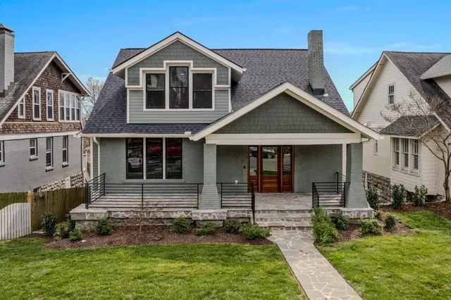 an empty room with wooden floor ceiling fan and window