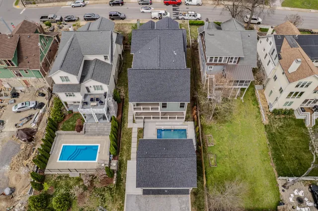 a kitchen with stainless steel appliances granite countertop a stove a microwave and a refrigerator