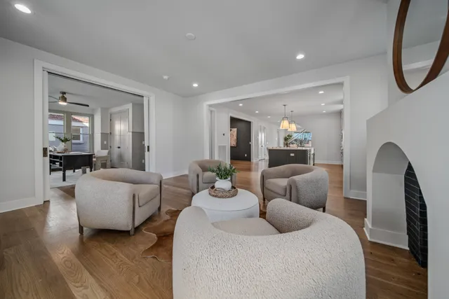 a living room with furniture and a dining room