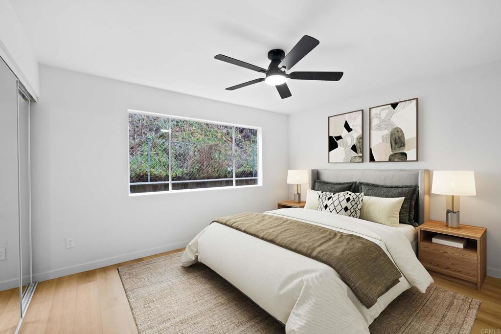 6775 Alvarado Road, Unit 26 San Diego, CA 92120 - Photo 16 of 24 a bedroom with a bed and a window