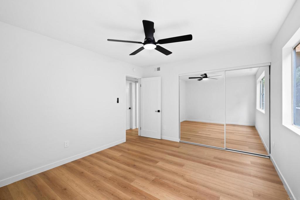 6775 Alvarado Road, Unit 26 San Diego, CA 92120 - Photo 17 of 24 a view of empty room with wooden floor
