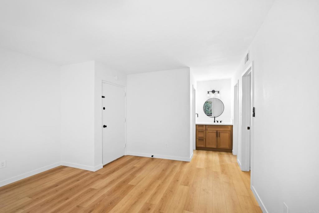 6775 Alvarado Road, Unit 26 San Diego, CA 92120 - Photo 21 of 24 a view of a room with wooden floor