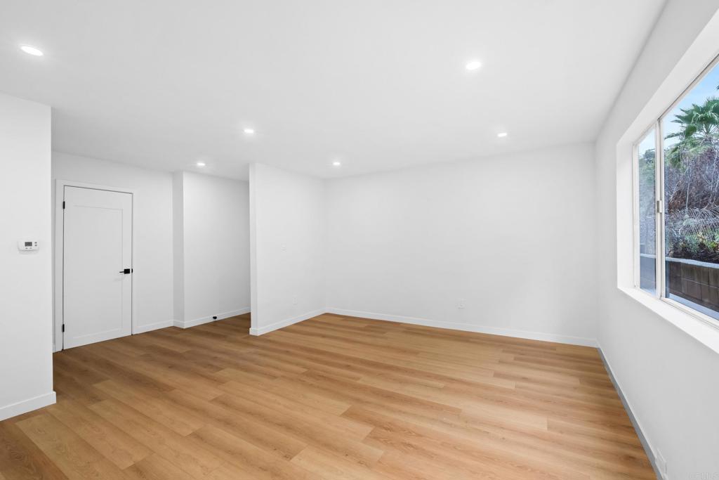 6775 Alvarado Road, Unit 26 San Diego, CA 92120 - Photo 5 of 24 a bedroom with a bed and a window