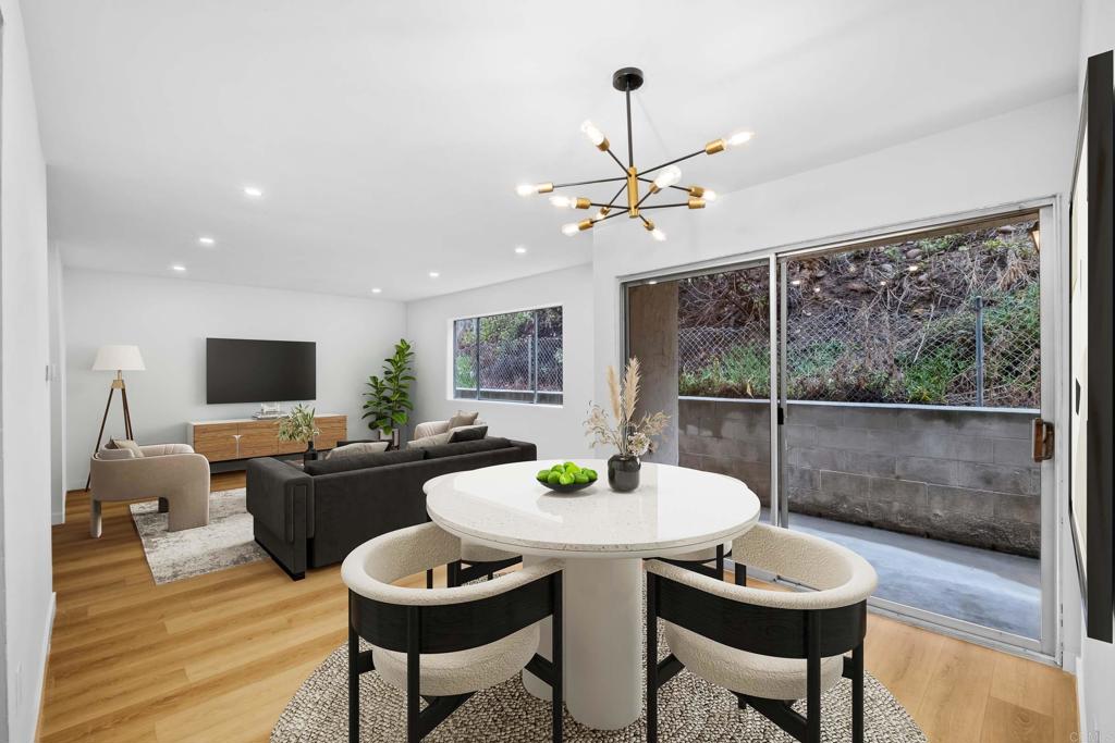 6775 Alvarado Road, Unit 26 San Diego, CA 92120 - Photo 8 of 24 a view of a dining room with furniture window and wooden floor