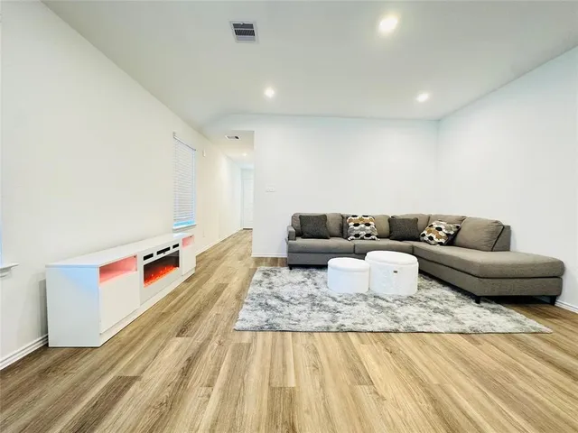 a living room with furniture and a couch