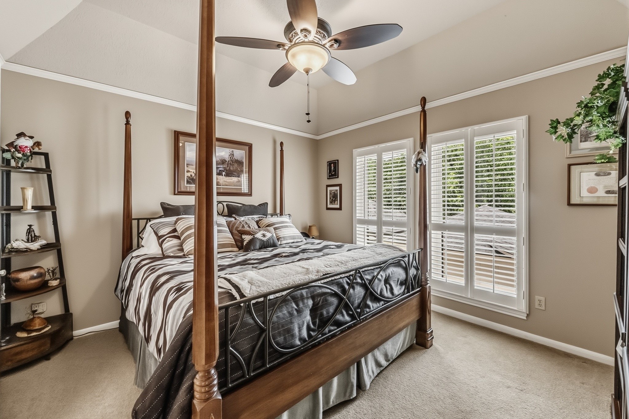 6047 Spring Creek Lane Spring, TX 77379 - Photo 29 of 50 Positioned away from the main entertaining areas, this secondary bedroom offers a quieter, more private retreat within the home. Soft natural light, classic proportions, and plantation shutters carried throughout much of the residence give the space a calm, timeless feel.