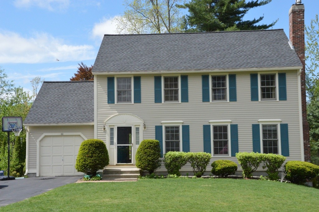 61 Stonegate Road Chelmsford, MA 01824 - Photo 1 of 17 front view of a house with a yard