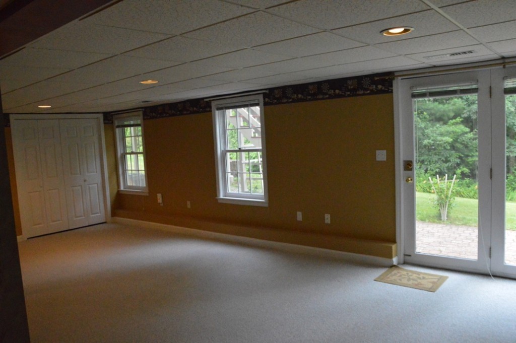 61 Stonegate Road Chelmsford, MA 01824 - Photo 12 of 17 an empty room with windows