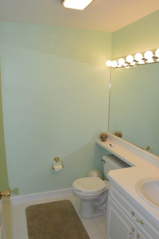 61 Stonegate Road Chelmsford, MA 01824 - Photo 14 of 17 a bathroom with a sink a toilet and shower