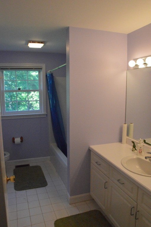 61 Stonegate Road Chelmsford, MA 01824 - Photo 15 of 17 a bathroom with a sink and a mirror