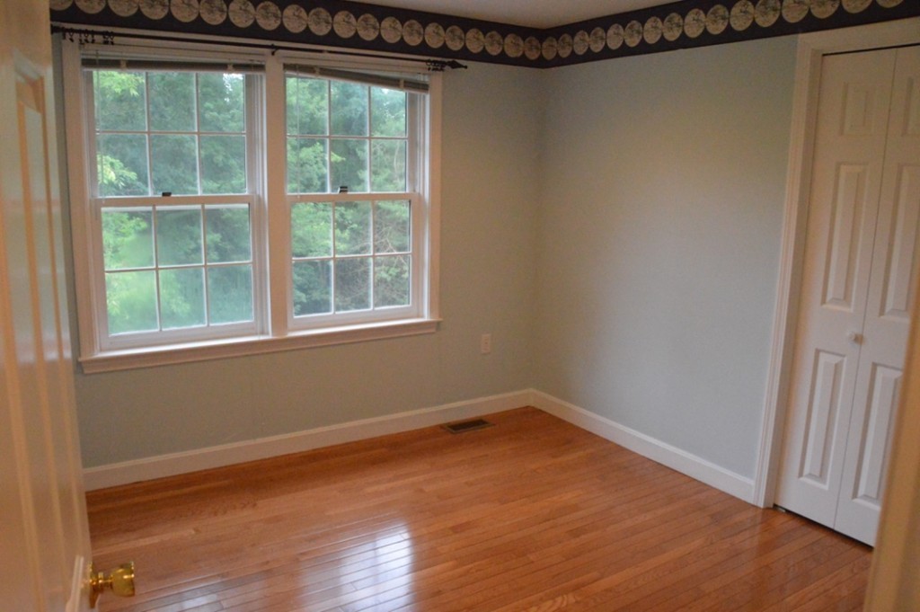 61 Stonegate Road Chelmsford, MA 01824 - Photo 10 of 17 a view of a room that has a window in it