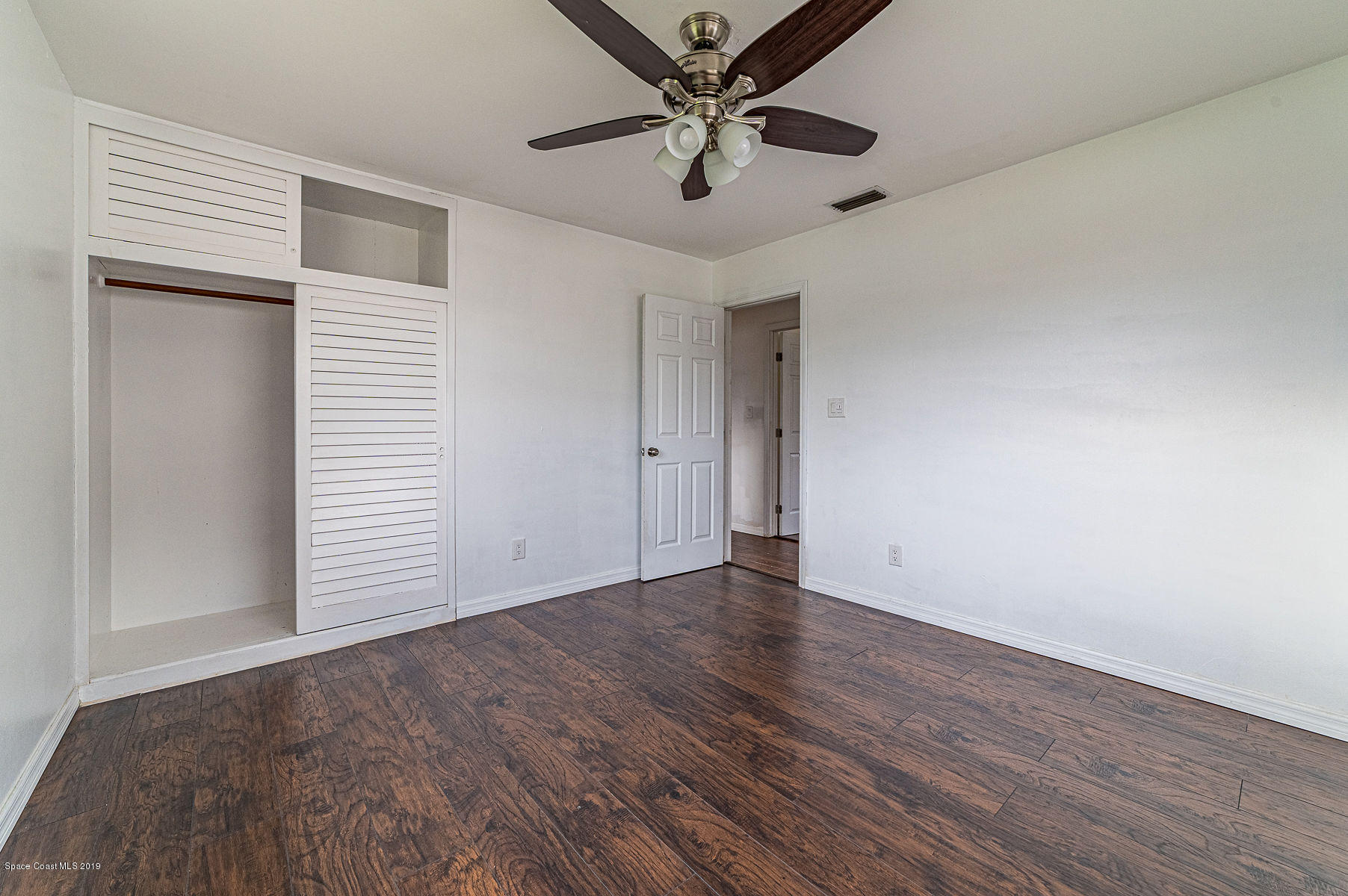 496 Seacrest Avenue Merritt Island, FL 32952 - Photo 27 of 33 wooden floor in an empty room