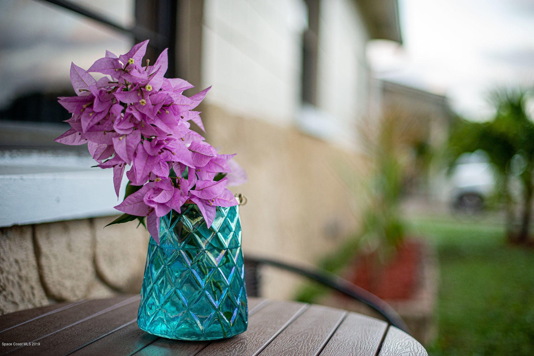 496 Seacrest Avenue Merritt Island, FL 32952 - Photo 32 of 33 a vase of flowers sitting on a table