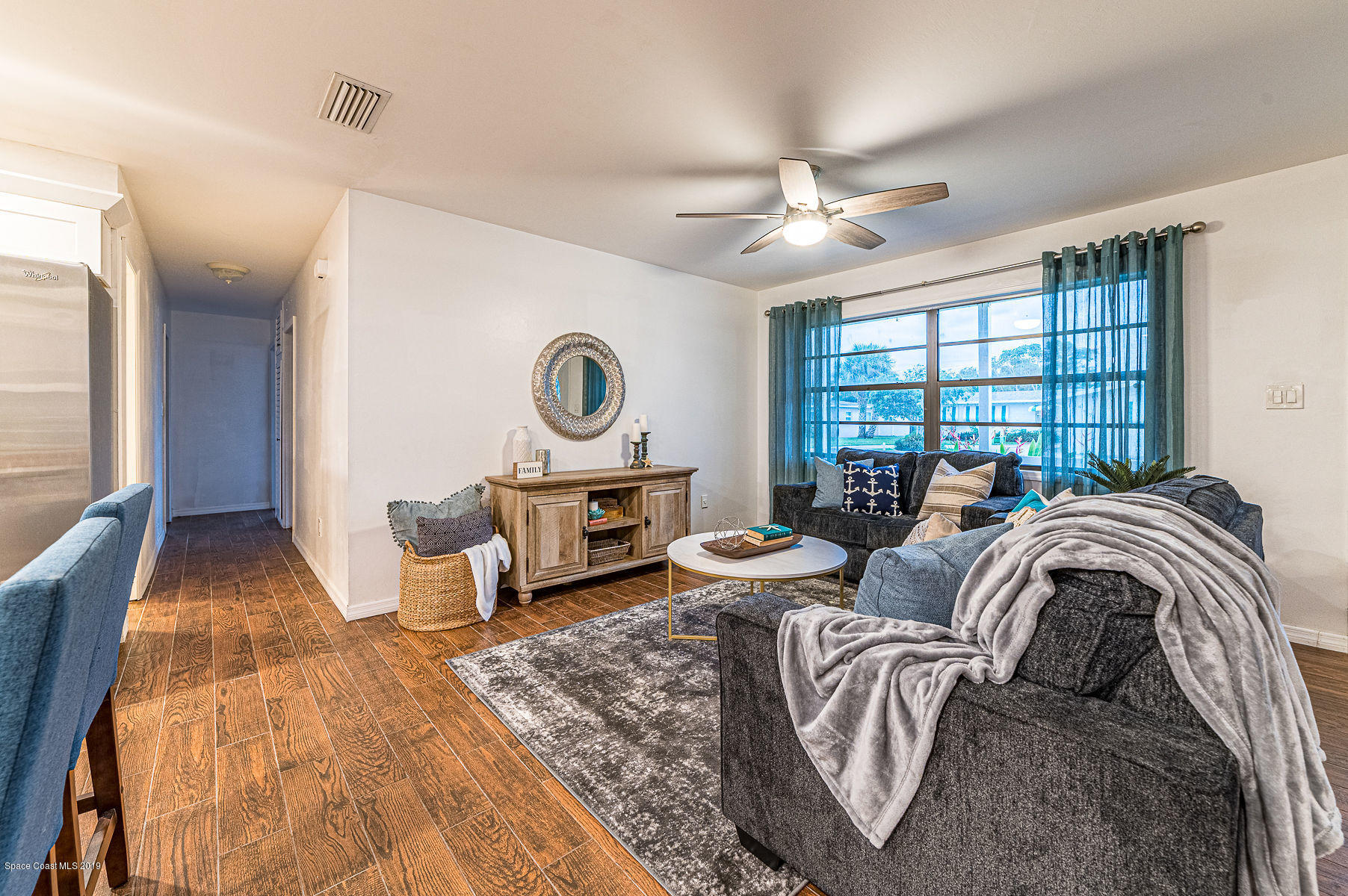 496 Seacrest Avenue Merritt Island, FL 32952 - Photo 5 of 33 a spacious bedroom with a bed and glass walk in closet