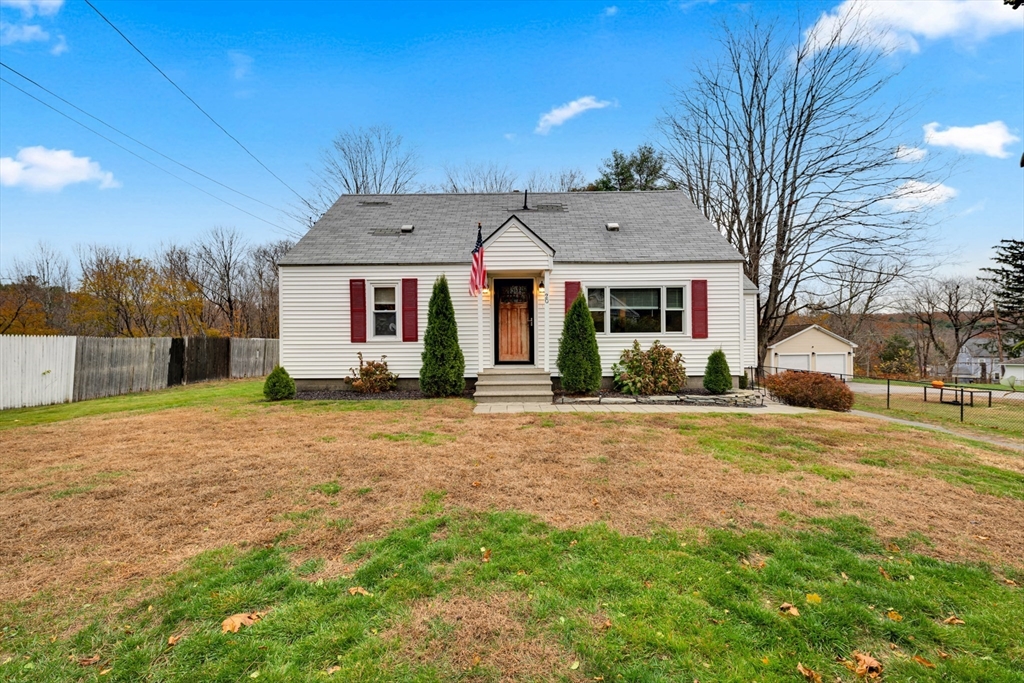 20 Leicester Street Oxford, MA 01537 - Photo 2 of 22 a front view of a house with a yard and garage