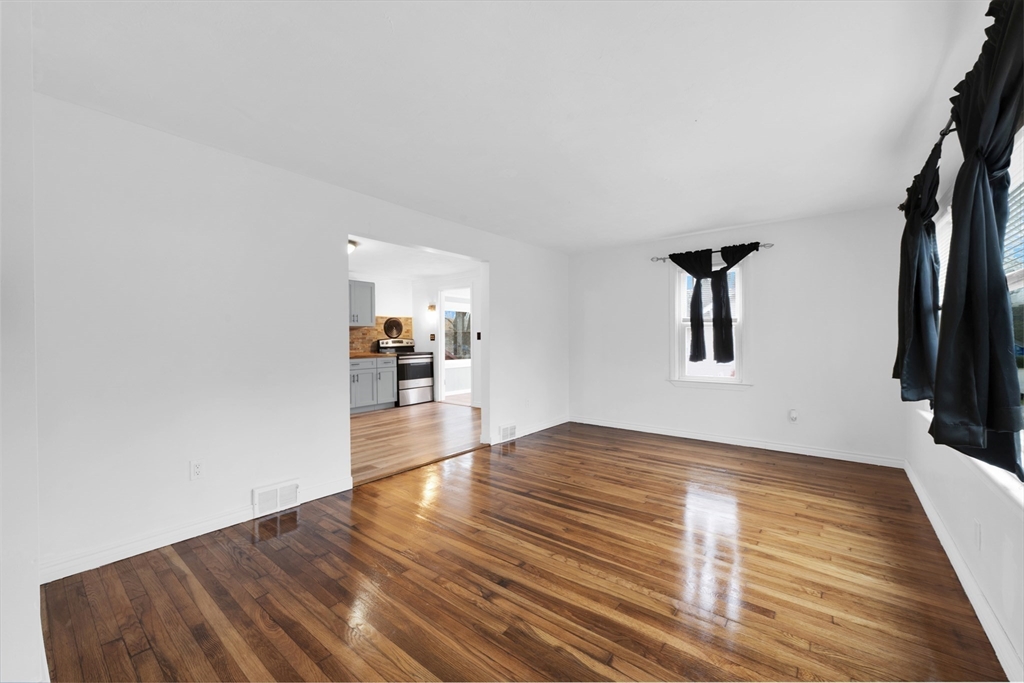 20 Leicester Street Oxford, MA 01537 - Photo 8 of 22 a view of empty room with wooden floor and fan