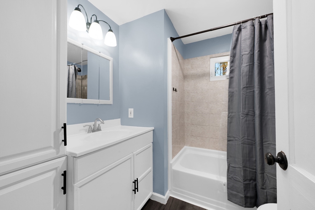 20 Leicester Street Oxford, MA 01537 - Photo 9 of 22 a bathroom with a bathtub a shower a sink and mirror