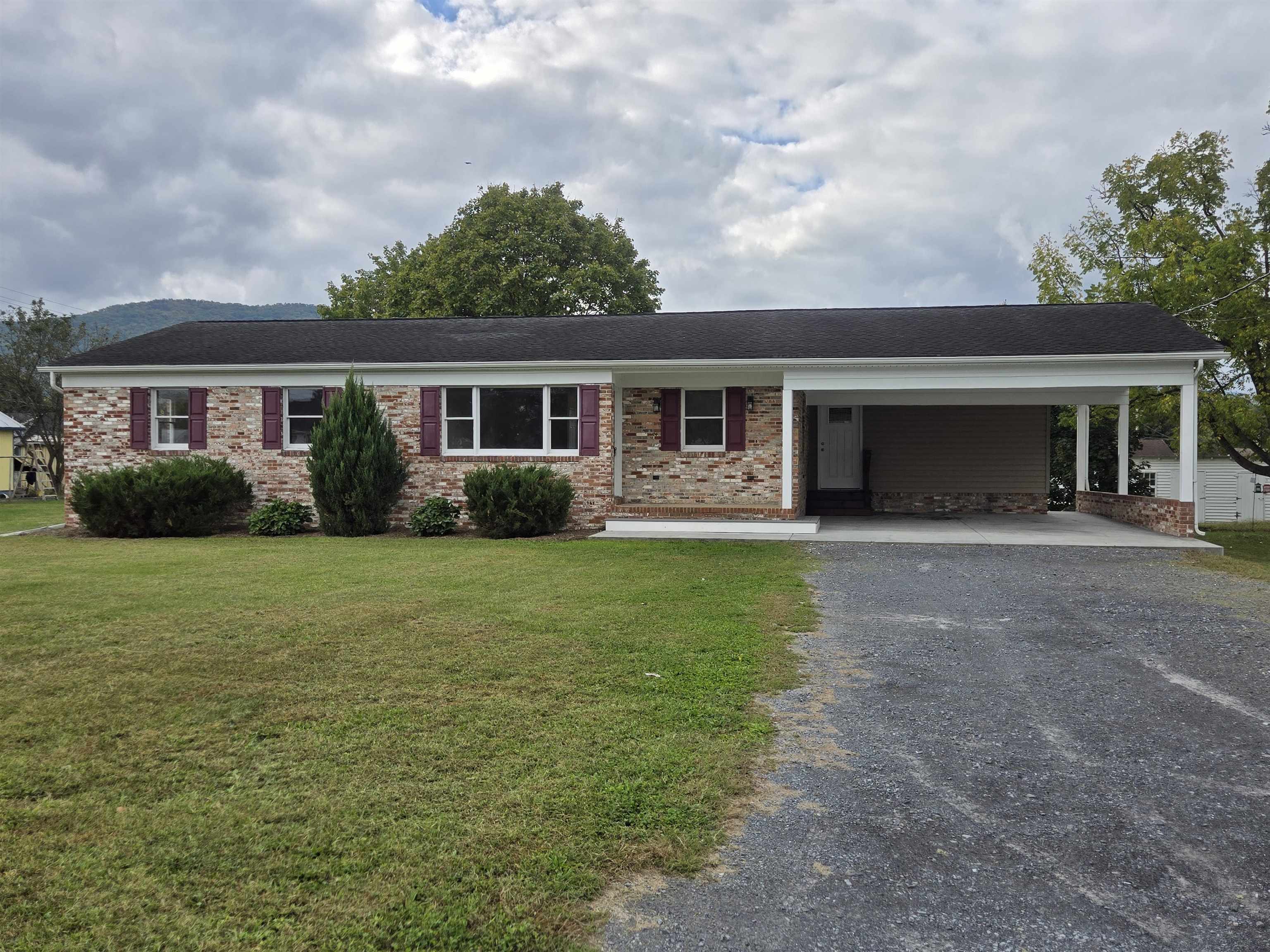 307 West Spring Avenue Elkton, VA 22827 - Photo 1 of 28 a front view of house with yard and green space