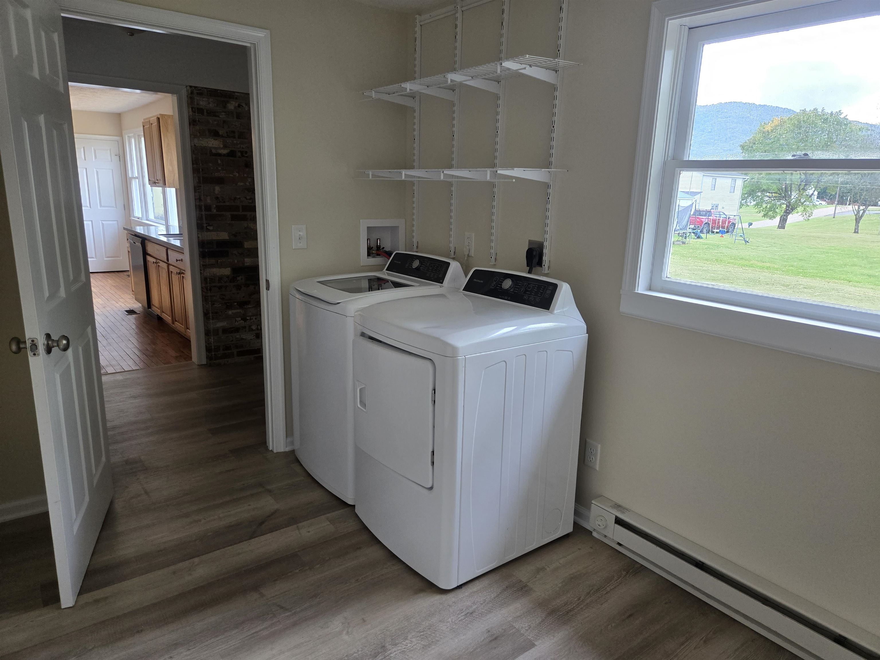307 West Spring Avenue Elkton, VA 22827 - Photo 12 of 28 a utility room with wooden floor washer and dryer