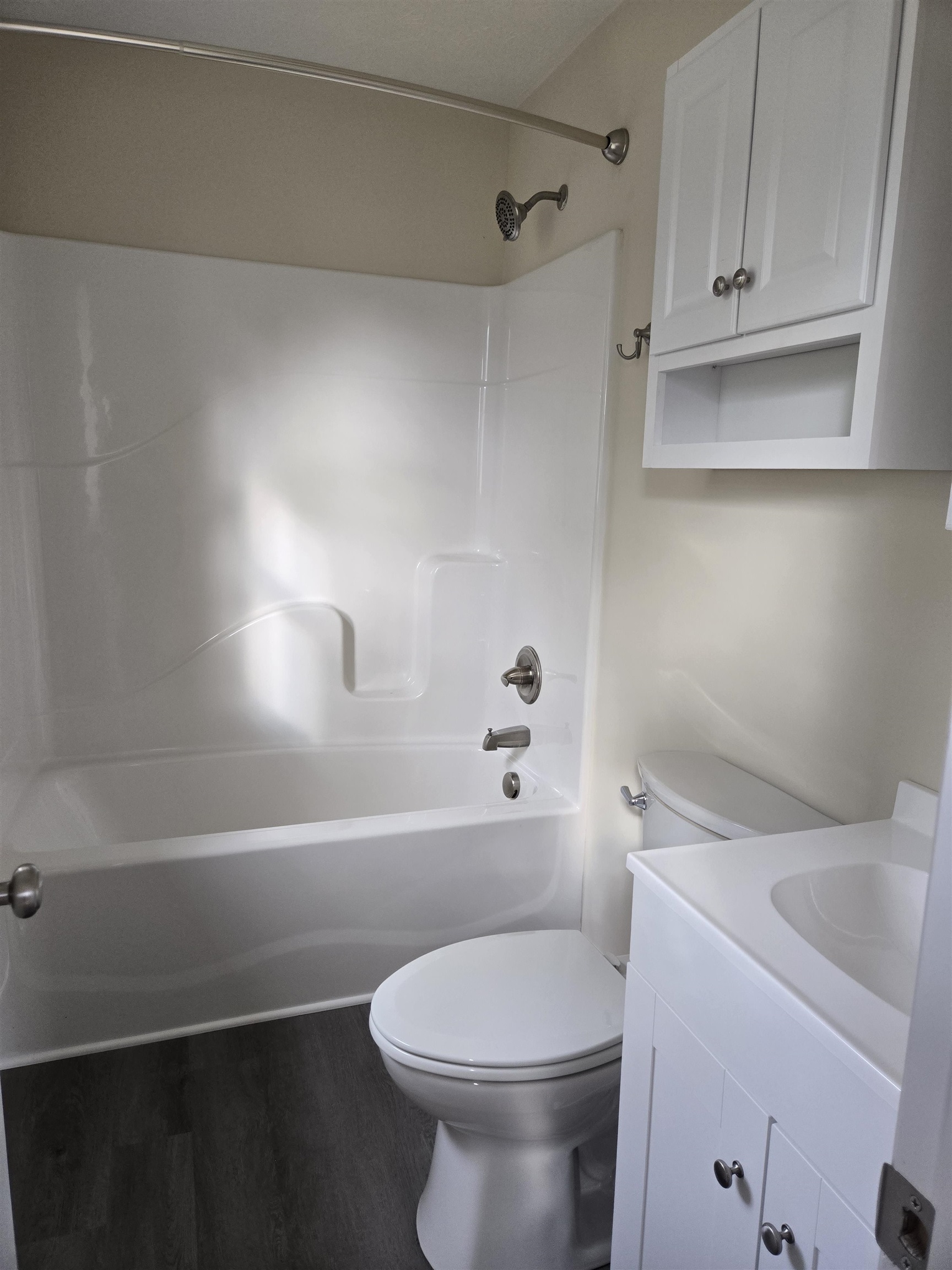 307 West Spring Avenue Elkton, VA 22827 - Photo 19 of 28 a white toilet sitting next to a bath tub