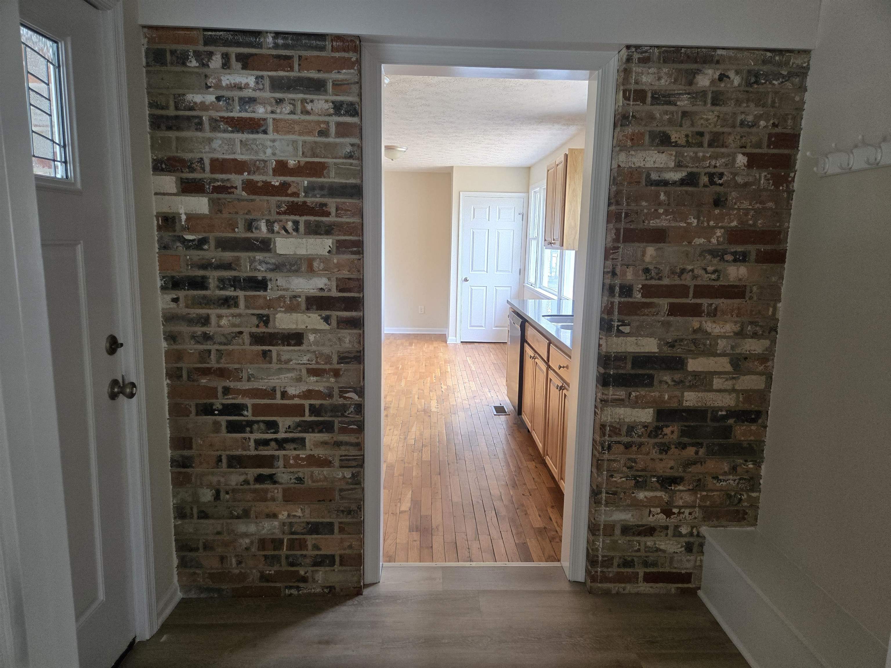 307 West Spring Avenue Elkton, VA 22827 - Photo 9 of 28 a view of a hallway with wooden floor and a window
