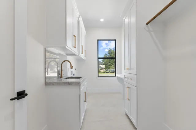 a view of a kitchen with a sink and dishwasher a kitchen view