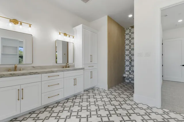a bathroom with a white shower and a bathtub
