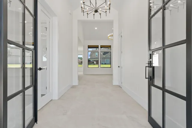 a view of an entryway with wooden floor