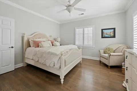 a spacious bedroom with a bed and a window